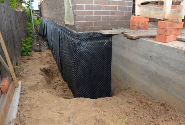 Happy homeowners after waterproofing job in Bunker Hill